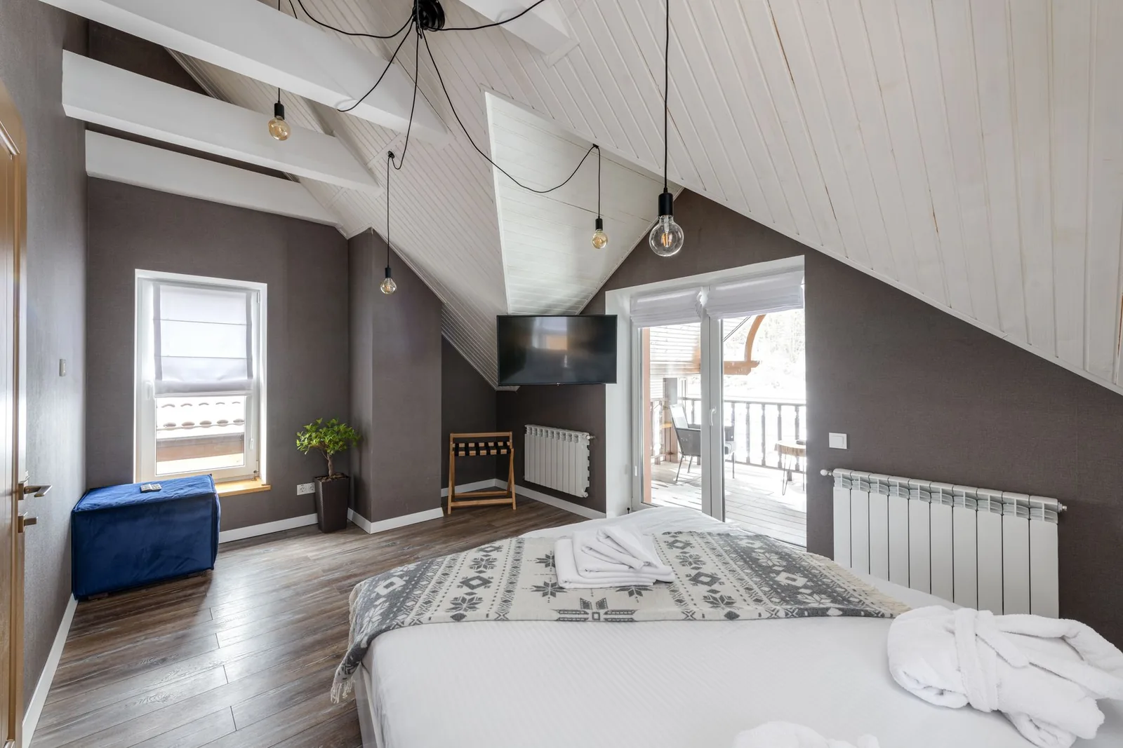 Beyoglu vintage hotels room with period oil paintings and wooden floors