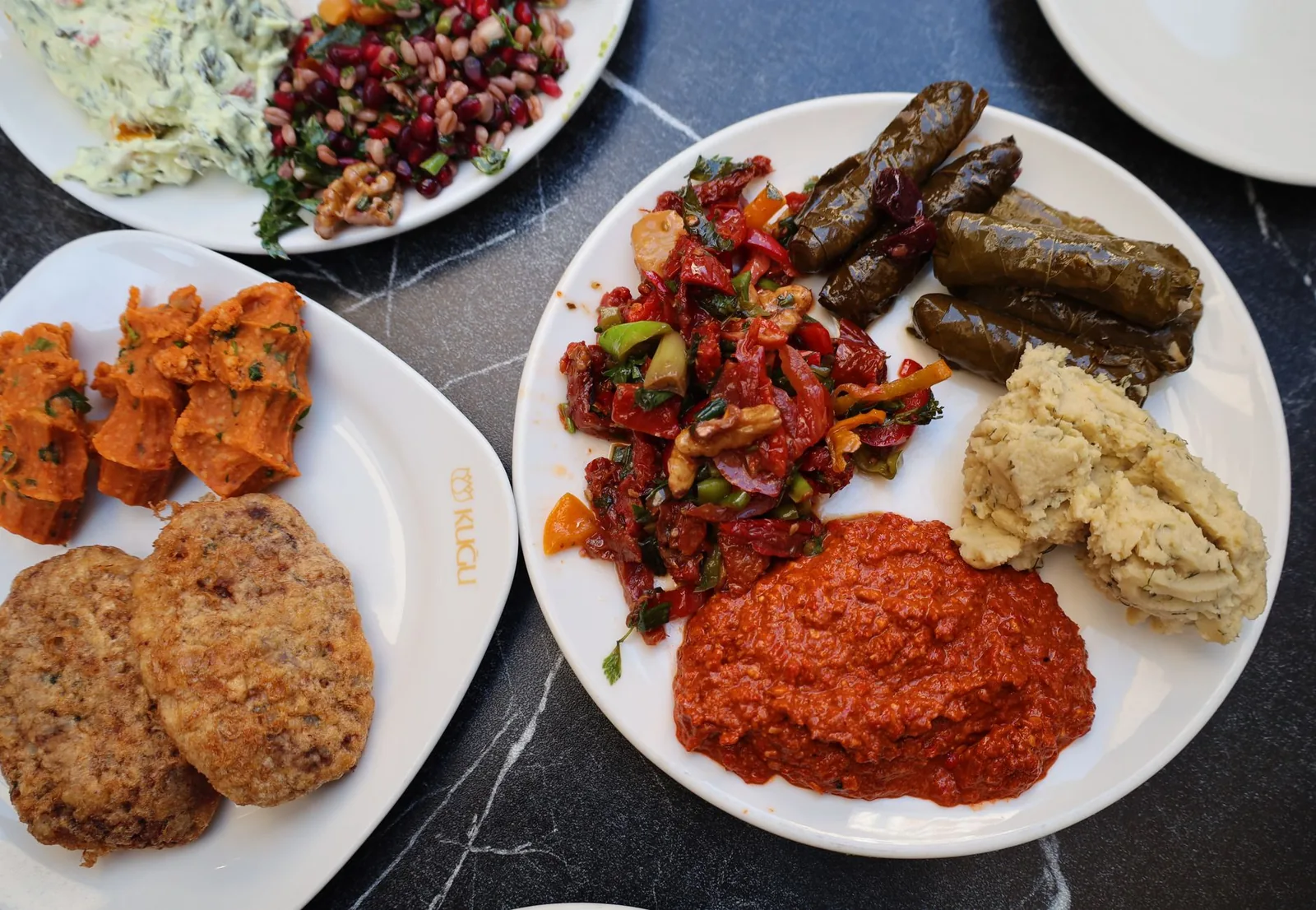 Small meze plates and raki glasses on a wooden table in Beyoglu